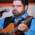 Dustin Pyrtle with Doyle Lawson & Quicksilver at the August 2015 Gettysburg Bluegrass Festival - photo by Frank Baker