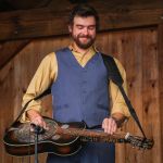 Brent Burke with Rhonda Vincent & The Rage playing a Dobro guitar that once belonged to Josh Graves at the August 2016 Gettysburg Bluegrass Festival - photo by Frank Baker