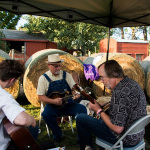 Michael Daves, Mike Compton, and Tony Trischka warming up backstage at the 2016 Old Tone Roots Music Festival - photo © Tara Linhardt