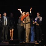 Junior Sisk hugs Tim Massey around the neck at the 2012 IBMA Awards Show - photo by Dan Loftin