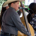 Elijah Baker with The Baker Family at the 2016 Musicians Against Childhood Cancer festival - photo by Daniel Mullins