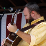 Joshua Richards with Michael Cleveland & Flamekeeper at the 2016 Musicians Against Childhood Cancer festival - photo by Daniel Mullins