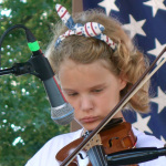 Member of the MACC Children’s Band at the 2016 Musicians Against Childhood Cancer festival - photo by Daniel Mullins