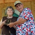 Faye Wilder accepts the SMBMA Hall of Honor induction for her and husband, Jim, from Bill Warren at the 2016 Milan Bluegrass Festival