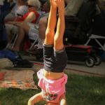 Standing on her head for bluegrass at the 2016 Bluegrass Bluegrass on the Grass festival on the campus of Dickinson College - photo by Frank Baker