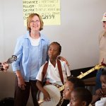 Tricia Dooley with a new South African banjo picker - photo by Kevin Dooley