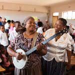 Teachers at a South African school give the banjo a spin - photo by Kevin Dooley