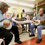 Joe Deetz and Gene Knight trade licks on eachothers RB-3 wreaths at Banjothon 2013 - photo © Dean Hoffmeyer