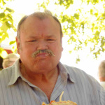 James King with a mouthful at Bean Blossom 2012 - photo © MaryE Yeomans