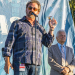 Dan Tyminski accepts the 2021 Bluegrass Star Award from the Bluegrass Heritage Foundation, presented by Alan Tompkins and Del McCoury (10/16/21) - photo by Nate Dalzell