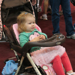 Lovely young lady enjoying Steve Thomas and Mark Newton at Summer NAMM 2012 - photo by Woody Edwards