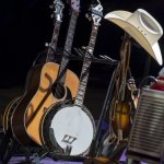 Quicksilver's instruments stowed during a cappella number at the 2014 Bluegrass and Chili Festival - photo by Tom Dunning