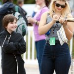 Shelby Means with Della Mae signs an autograph for a young fan at The Festy 2013 - photo © Gina Elliott Photographer