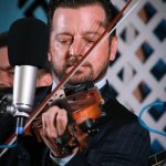 Jason Carter with the Del McCoury Band at the 2013 Delaware Valley Bluegrass Festival - photo by Frank Baker