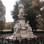 Statue in the park marked with WWII bullet holes in Berlin seen during the Po' Ramblin' Boys' 2016 Back To The Mountains EuroTour