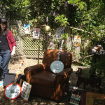 Videographer Sarah Fisher checks the set, which includes many of Bill's banjos and show posters