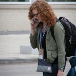 Becky Buller multi-tasking at World of Bluegrass 2016 - photo by Frank Baker