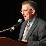 Tom Adams presenting the Distinguished Achievement Award to Bill Emerson at World of Bluegrass 2016 - photo by Frank Baker Union