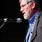 Art Menius presenting the Distinguished Achievement Award to Jim Rooney at World of Bluegrass 2016 - photo by Frank Baker
