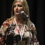 Kim Robins sings in a songwriter showcase at Wide Open Bluegrass 2016 - photo by Frank Baker