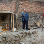 Master luthier and his wife next to his workshop - photo by Tara Linhardt