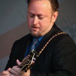 Jesse Brock with The Gibson Brothers at the Gettysburg Bluegrass Festival (August 2014) - photo by Frank Baker