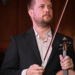 Clayton Campbell with The Gibson Brothers at the Gettysburg Bluegrass Festival (August 2014) - photo by Frank Baker