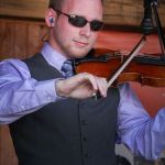 Stephen Burwell with Doyle Lawson & Quicksilver at the August 2015 Gettysburg Bluegrass Festival - photo by Frank Baker