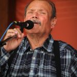 James King singing with Seldom Scene at the August Gettysburg Bluegrass Festival - photo by Frank Baker