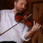 Adam Haynes with Grasstowne at the August 2013 Gettysburg Bluegrass Festival - photo by Frank Baker