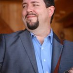 Aaron McDaris with Rhonda Vincent at the August 2013 Gettysburg Bluegrass Festival - photo by Frank Baker