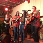 Kaly Gold singing with her older sisters in Austria during Gold Heart's 2015 European tour