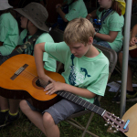 Pick in the soundhole at the 2015 Grey Fox Bluegrass Festival - photo © Tara Linhardt