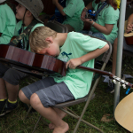 Pick in the soundhole at the 2015 Grey Fox Bluegrass Festival - photo © Tara Linhardt