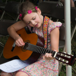 Guitar student at the Kids Academy at the 2015 Grey Fox Bluegrass Festival - photo © Tara Linhardt