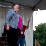 Katy Daly MCing at the 2015 Grey Fox Bluegrass Festival - photo by Tara Linhardt