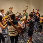The Meyers jam at the IBMA Youth Room at World of Bluegrass 2013 - photo by Tara Linhardt