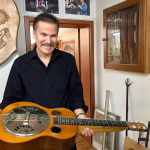 Rosta was showing Rob Ickes one of the Dopyera Brothers' very first resonator guitars. The neck is hollow (the Dobro's neck, not Rob's).