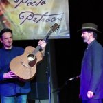 Henrich Novak accepts Peter Dula’s traveling guitar in Kosice, Slovakia - photo by Peter Lazarak