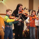 Lizzy Long fiddling with Canyon and Autumn Moore at the Little Roy & Lizzy Show in Newport, PA (3/9/13) - photo by Frank Baker