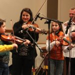Lizzy Long fiddling with Canyon and Autumn Moore at the Little Roy & Lizzy Show in Newport, PA (3/9/13) - photo by Frank Baker