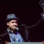Stephen Mougin accepts his Mentor Momentum Awards at the 2016 World of Bluegrass convention - photo © Tara Linhardt