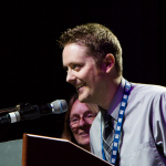 Jake Workman accepts his Instrumentalist Momentum Awards at the 2016 World of Bluegrass convention - photo © Tara Linhardt
