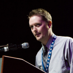 Jake Workman accepts his Instrumentalist Momentum Awards at the 2016 World of Bluegrass convention - photo © Tara Linhardt