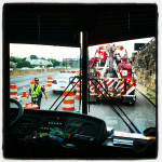Tow truck preparing to move Mountain Heart's leased bus from the entrance to the Lincoln Tunnel in New York City (July 20, 2012)