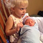 Big sister Liliana Munsey with her new baby brother James