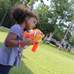 Blowing bubbles at the 2015 Norris Creek Pig Pickin' Bluegrass & BBQ Festival - photo © Laura Tate Photography