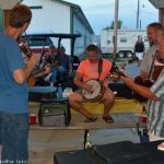 Harbourtown with fiddler Isaac Smith playing a little music for early arrivals at the 2016 Norwalk Music Festival - photo © Bill Warren