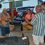 Harbourtown with fiddler Isaac Smith playing a little music for early arrivals at the 2016 Norwalk Music Festival - photo © Bill Warren