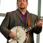 Aaron McDaris with his new Chief banjo at the Outer Banks Bluegrass Festival - photo by Woody Edwards